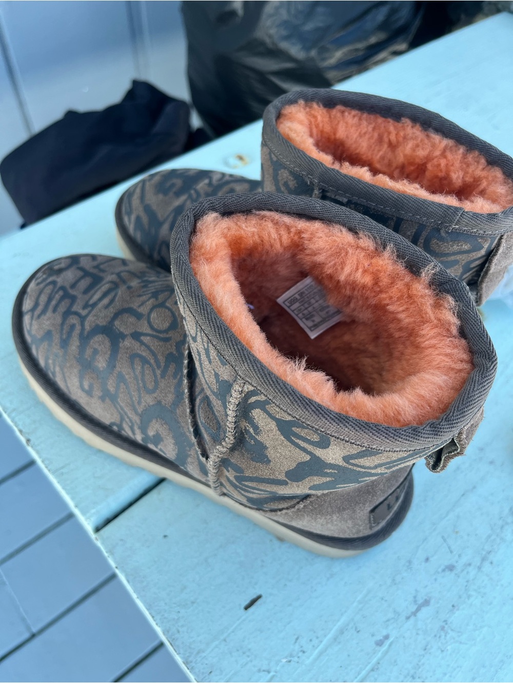 UGGS graffiti short boot, orange Sherpa inside, love  logo sz 6